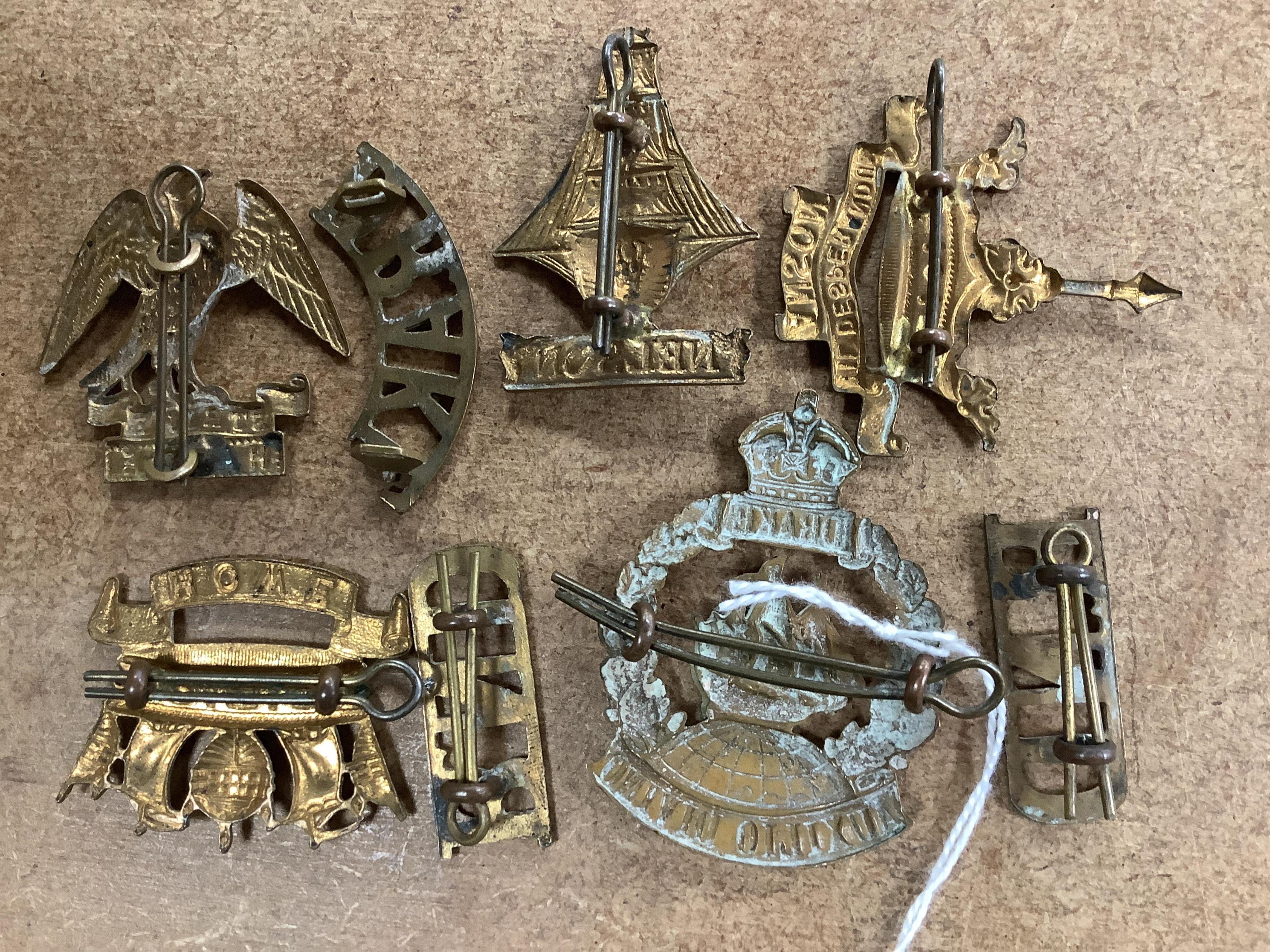 Five Royal Navy First World War brass cap badges; the Nelson, Hawke, Anson and Howe Battalions, together with three shoulder titles. Condition - fair, some possible restrikes.